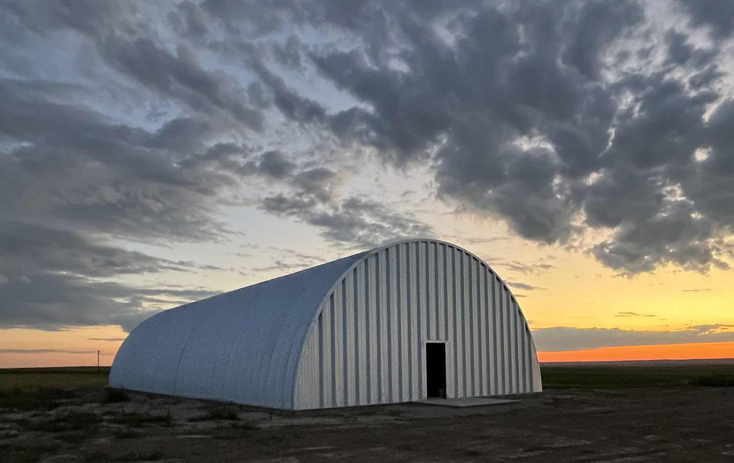 Arch equipment storage building